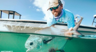 man surfing with costa glasses