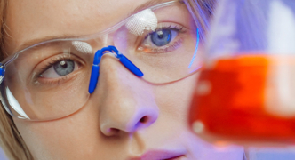 laboratory workers reading the measurement using prescription safety glasses