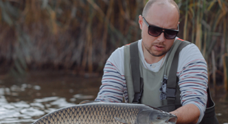 angler wearing fishing sunglasses